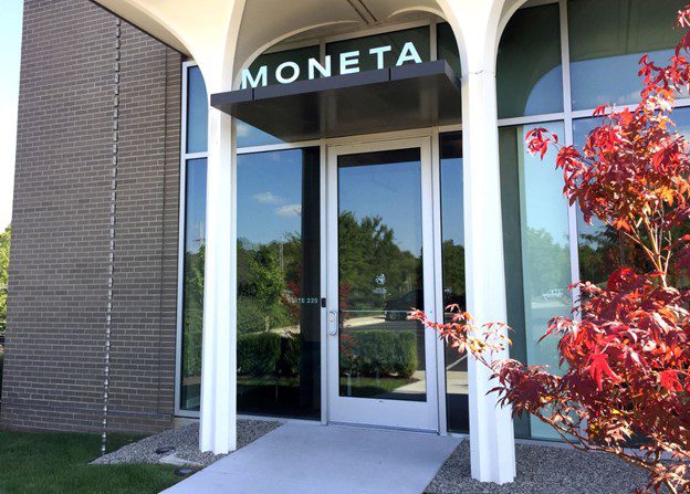 "Moneta" sign outside Kansas City office building or financial advisors